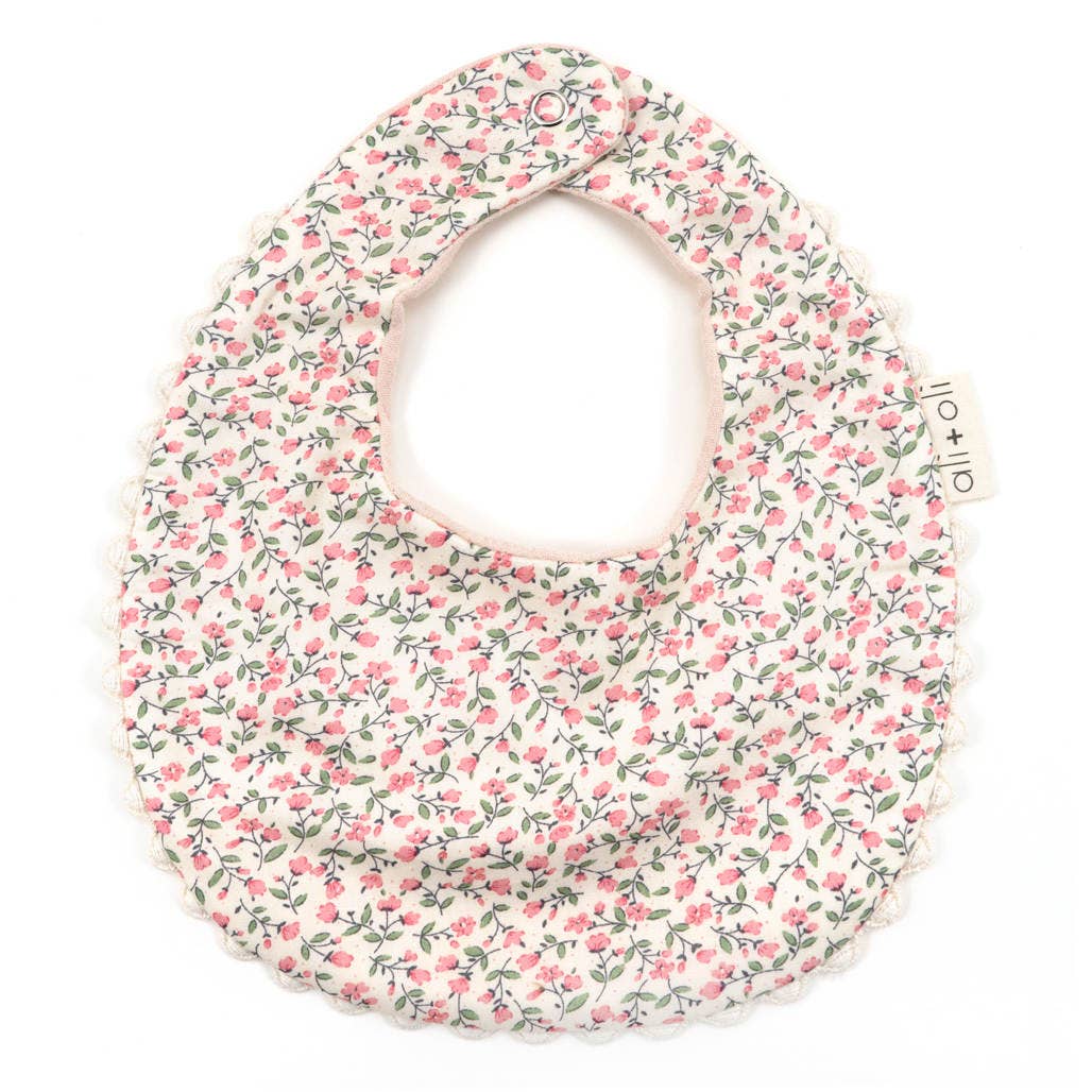 Floral patterned bib on a white background