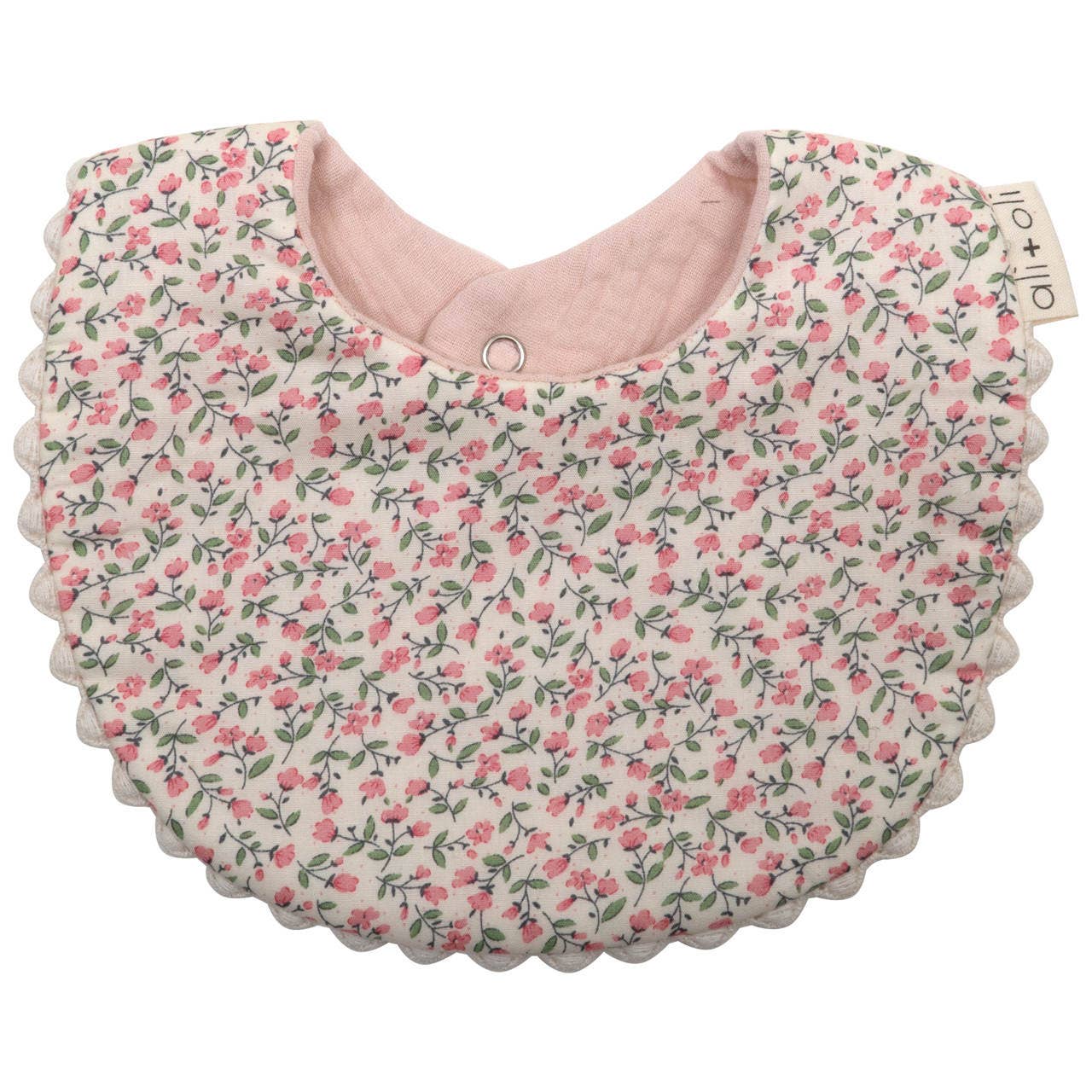 Floral patterned baby bib with pink interior on a white background