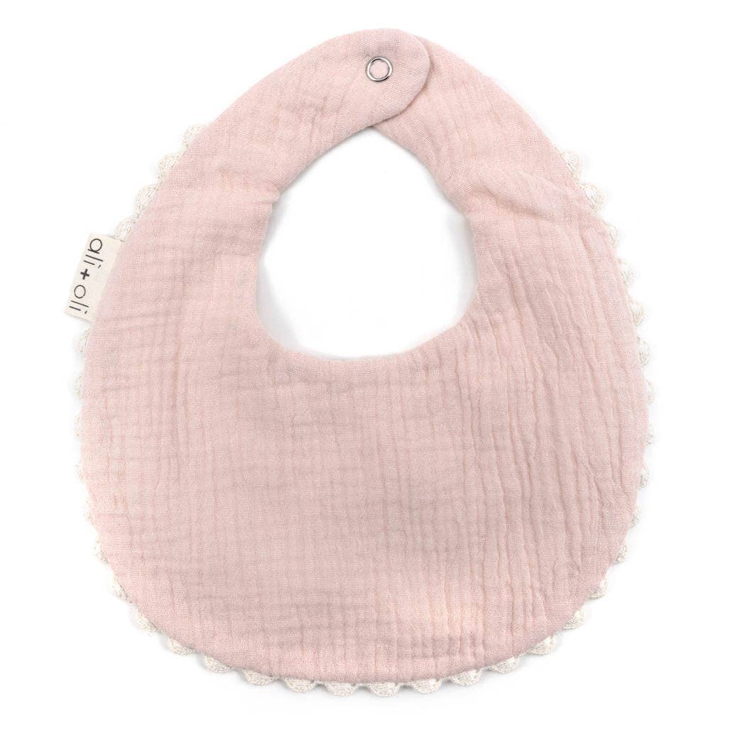 Pink textured bib on a white background
