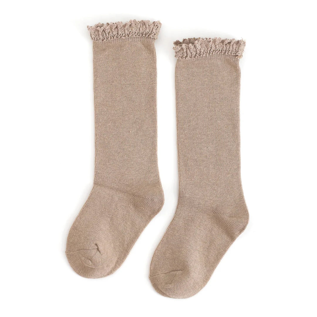 Pair of beige knee-high socks with lace trim on a white background