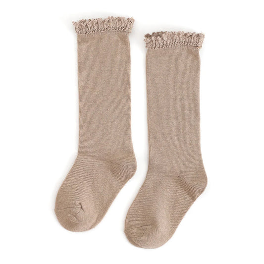 Pair of beige knee-high socks with lace trim on a white background