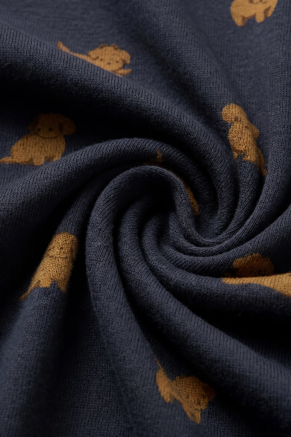 Navy fabric with small brown dog patterns