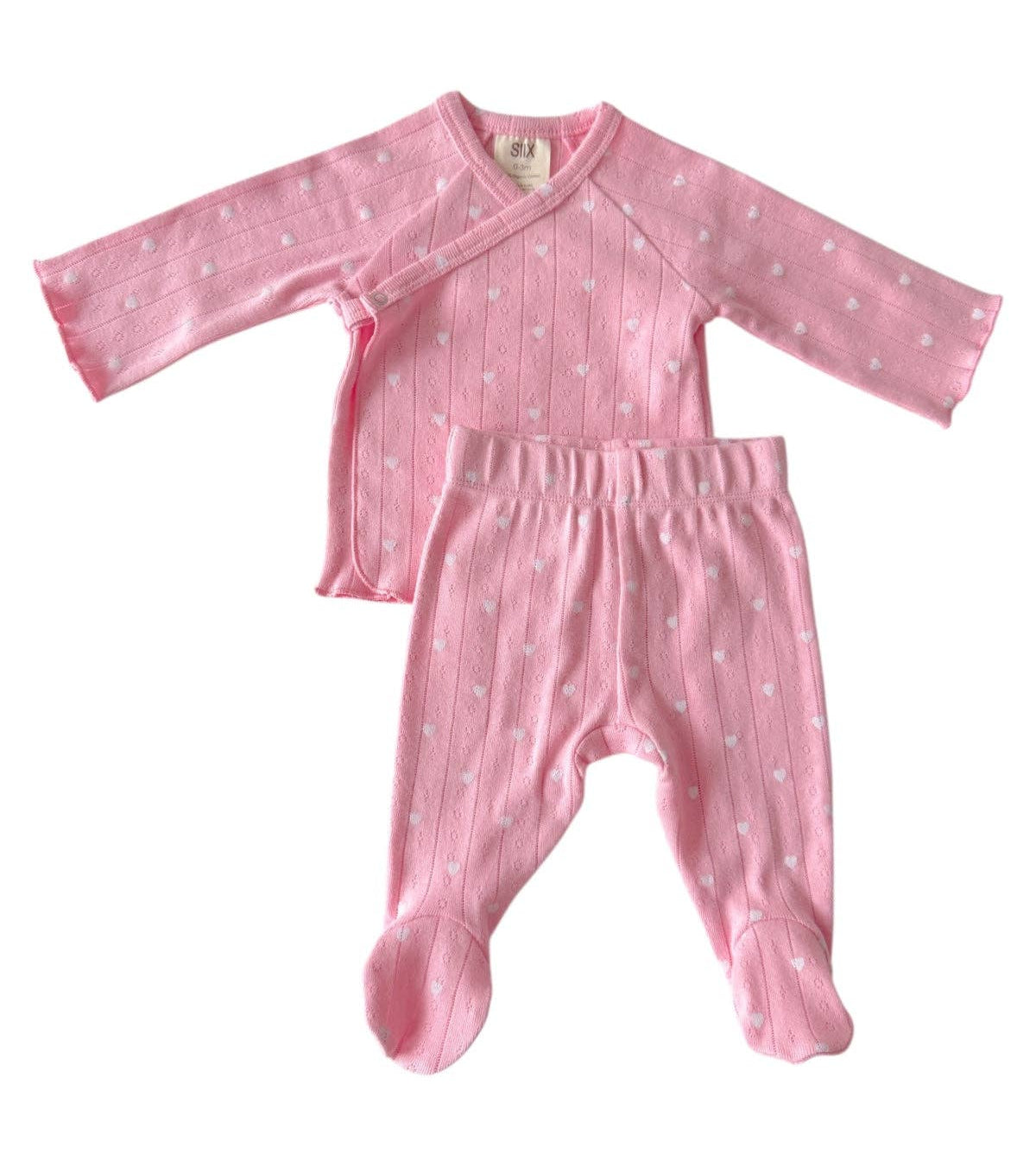 Pink baby outfit with long-sleeve top and footed pants on a white background
