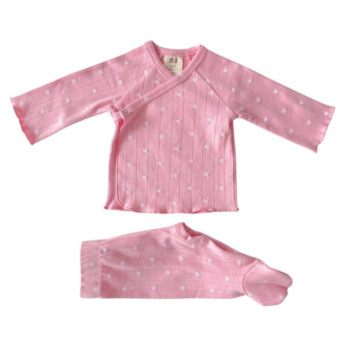 Pink baby outfit with long-sleeve top and pants on a white background