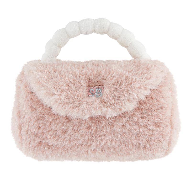 Pink fluffy handbag with white handle on a white background