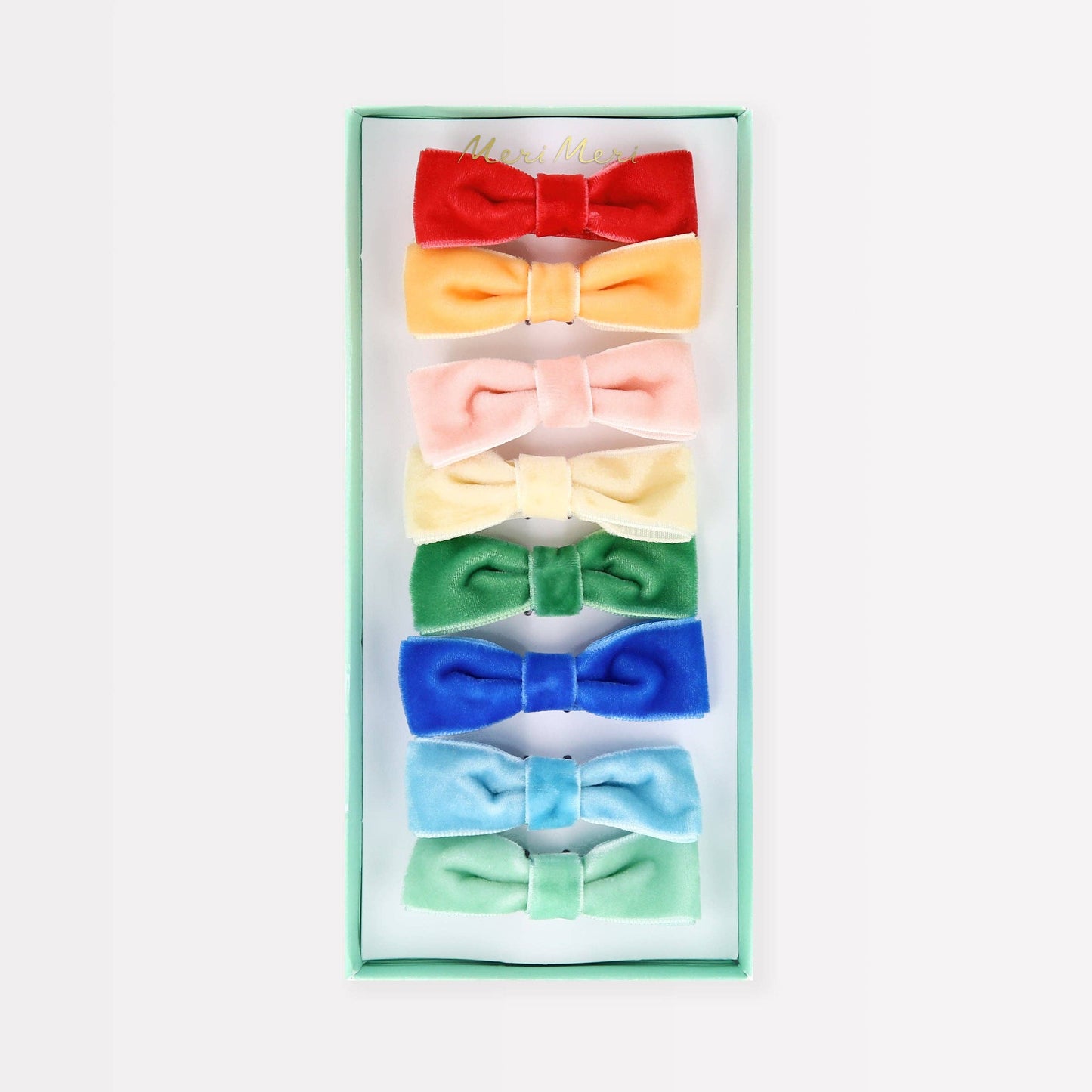 Set of colorful bow ties in a box on a white background