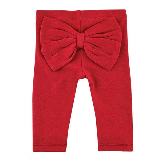 Red leggings with a large bow on a white background