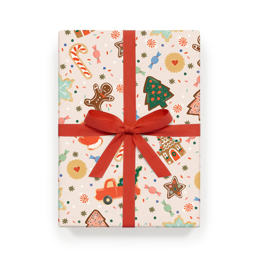 Gift box with festive design and red ribbon on a white background
