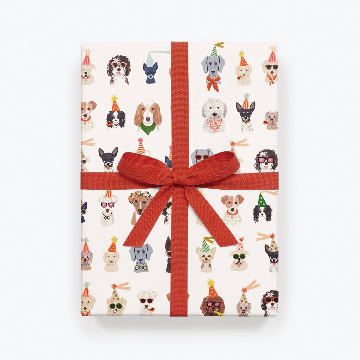 Gift box with dog illustrations and a red ribbon on a white background