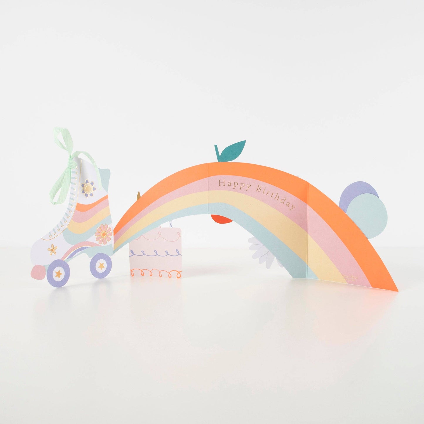 Colorful rainbow-shaped birthday card with a car and cat illustration on a light gray background
