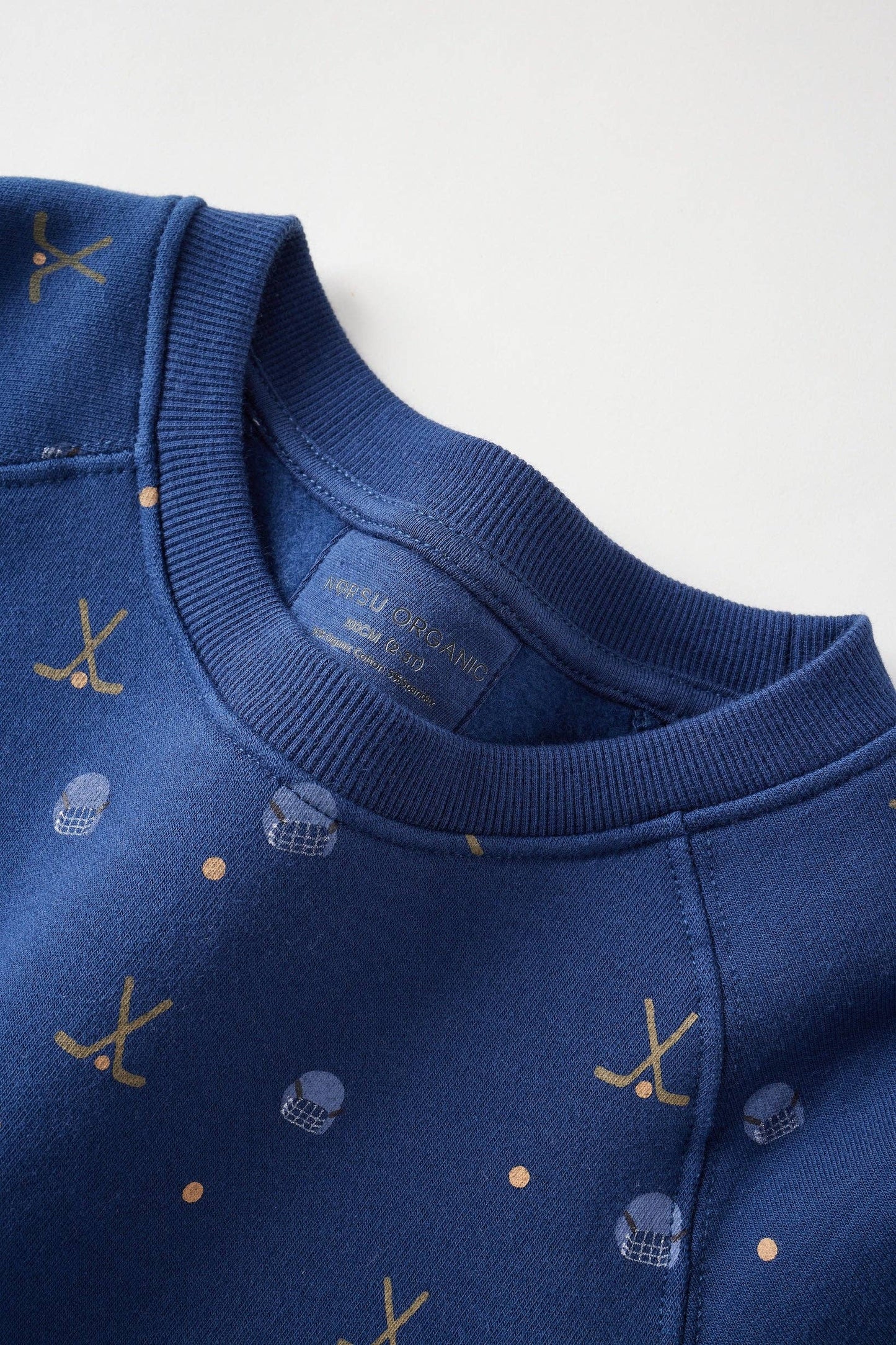 Close-up of a blue garment with patterns on a white background