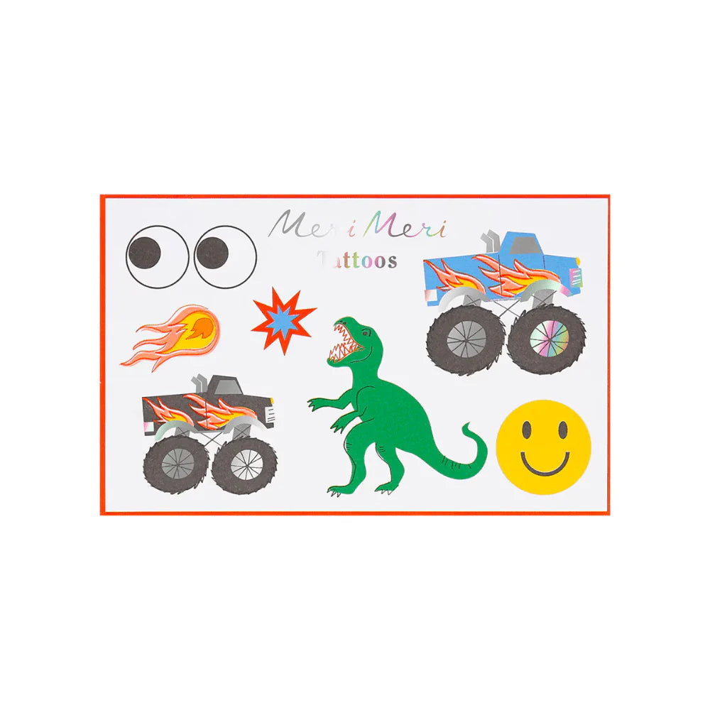 Sheet of temporary tattoos featuring monster trucks, a dinosaur, and a smiley face with 'Me & Meri' branding.