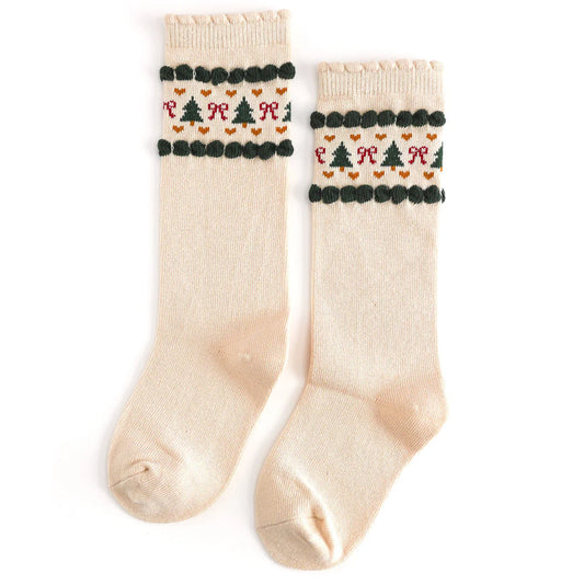 Pair of cream socks with festive pattern on a white background