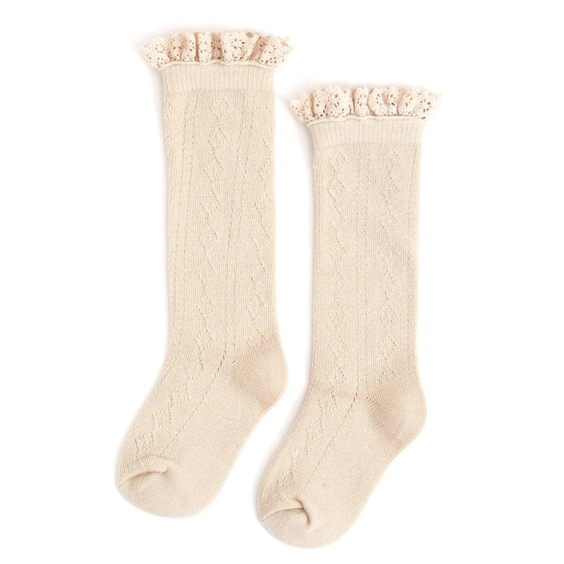 Pair of cream knee-high socks with lace trim on a white background
