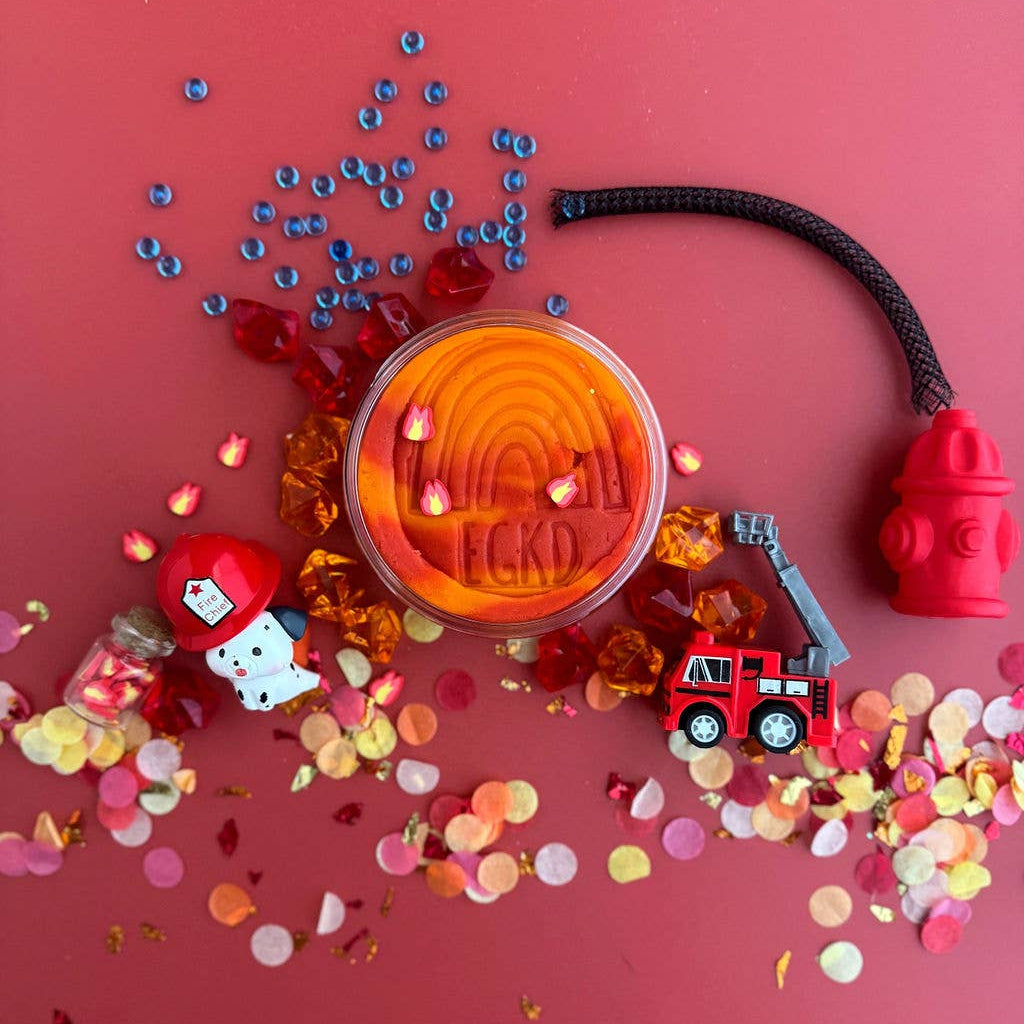 Colorful confetti with a transparent container labeled 'HOKI' on a red background