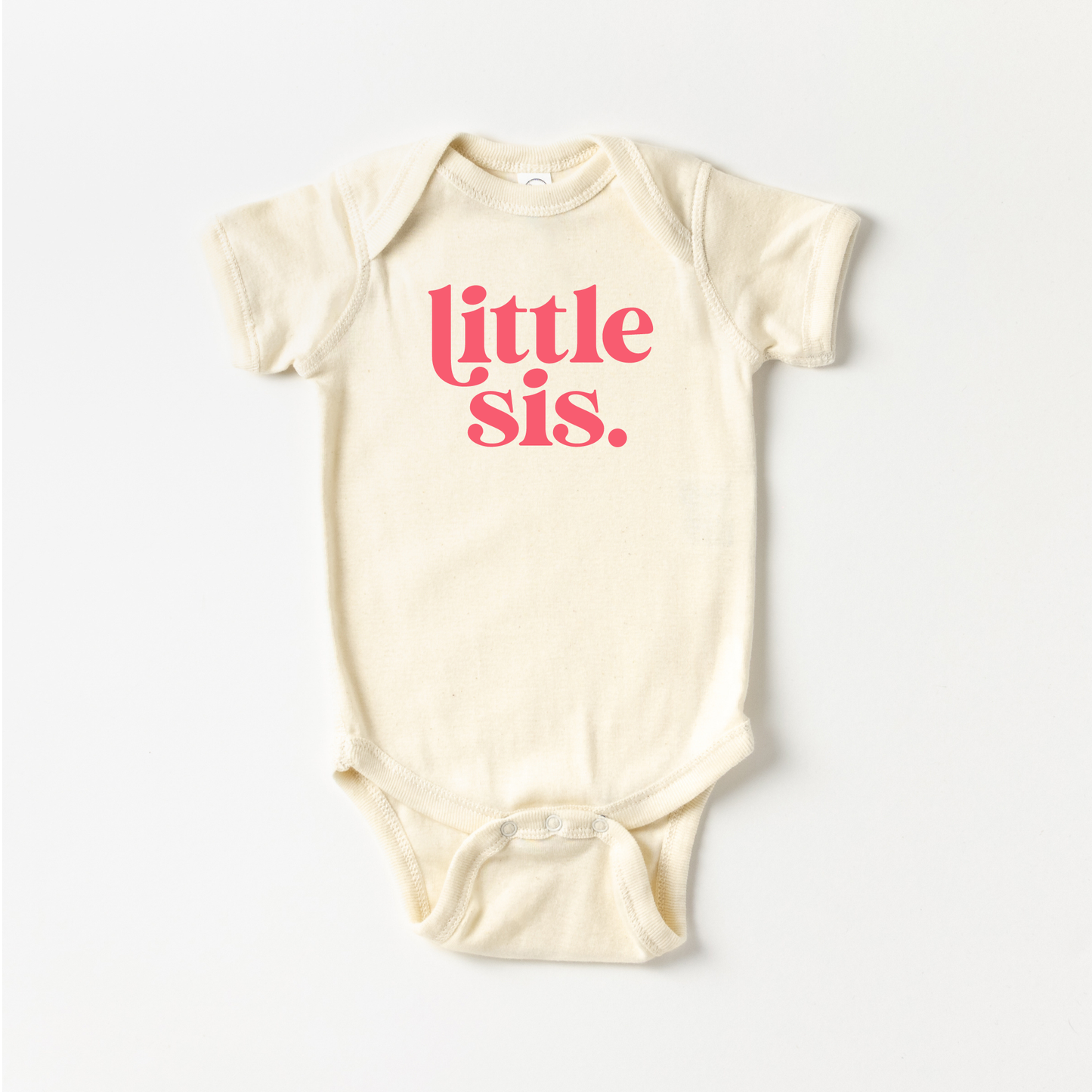 Baby onesie with 'little sis' text on a white background