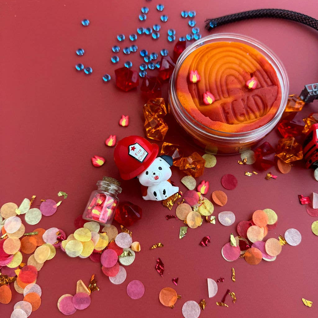 Jar of orange jelly with decorative elements on a red background