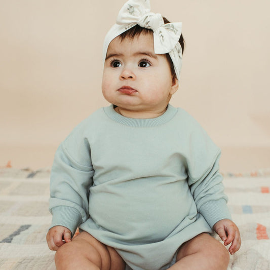 organic blue bubble romper on lovely baby