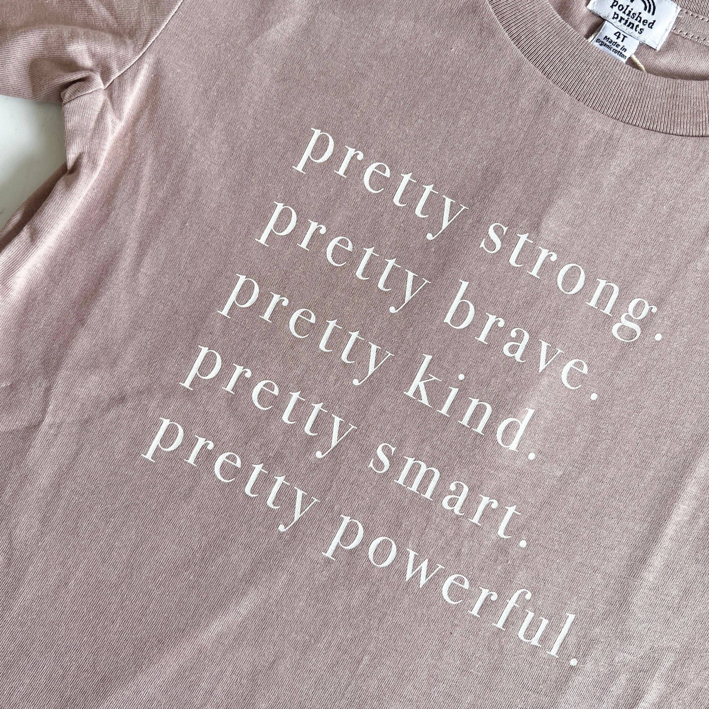 Pretty strong. Pretty brave. Pretty kind. Pretty smart. Pretty powerful. Dusty lavender.